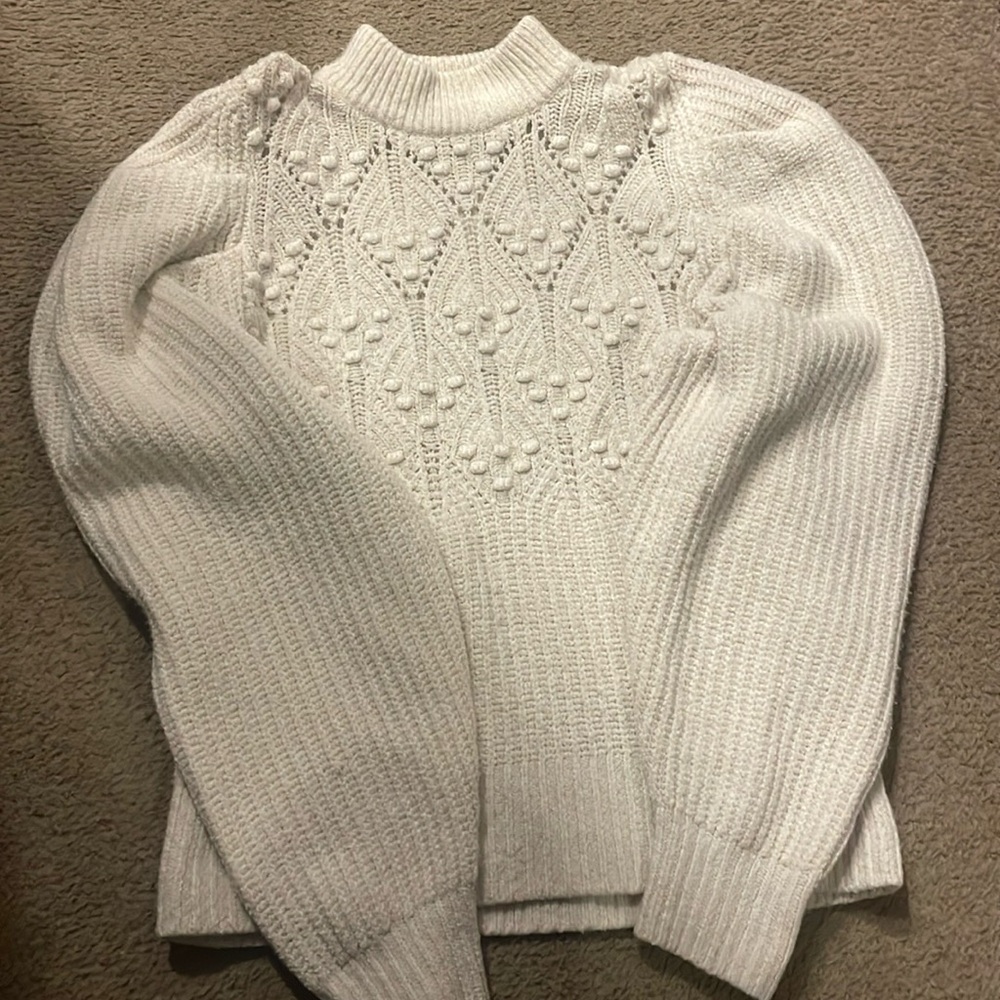 White sweater.
